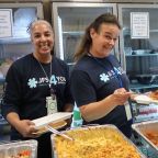 JFS Staff Members Liz Lovinsky and Bailey Pokres enjoy an International Food Day event